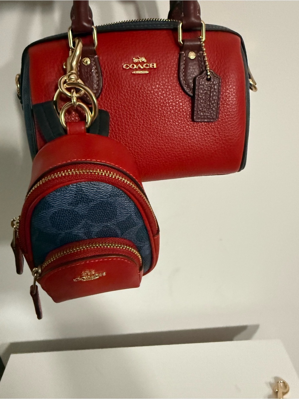 Coach Red Leather Mini Rowan with maroon Handles and Black Trim and charm bundle